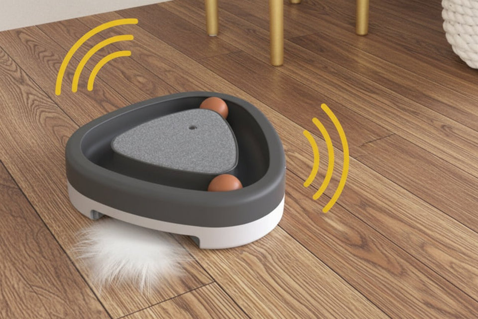 Electric triangle cat toy moving across the floor with motion effect