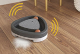 Electric triangle cat toy moving across the floor with motion effect