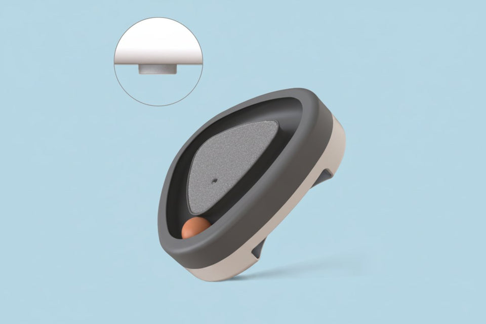 Close-up of automatic electric cat toy with smooth triangular design