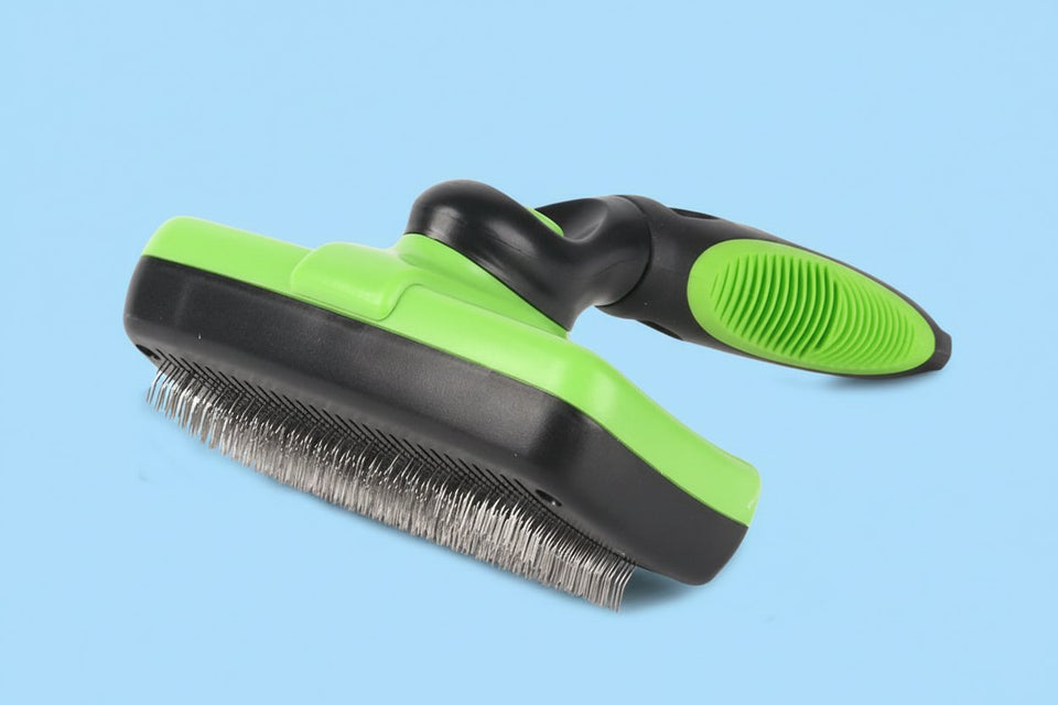 Green self-cleaning pet slicker brush with stainless steel pins