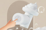 Cat being gently cleaned with electric foaming pet bath brush
