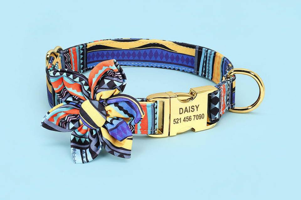 Assorted colorful floral dog collars with bows and personalized tags