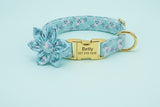 Teal floral printed dog collar with engraved name plate and flower accent